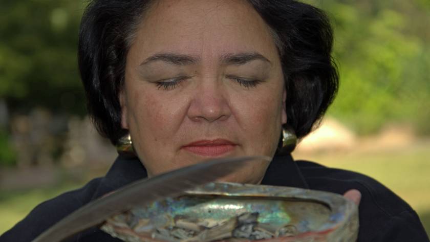 Lynn E. Fritz, MA, Karuk Tribal Descendant, offering smudge blessing.