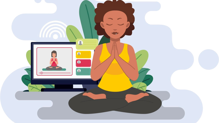 Woman sitting in meditation with laptop